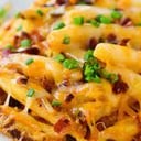 Foto de Papas fritas cheddar - jamón - verdeo