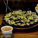 Foto de Conchas Asadas al Ajillo