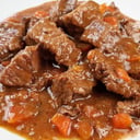 Foto de Carne en salsa papas sopa de menudencia jugo de mango pastas 