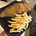 Foto de Milanga al plato con guarnición