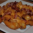 Foto de Papas rusticas con cheddar y panceta