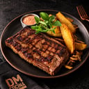Foto de Asado Americano + papas cuñas + cebollas crispy + emulsion de salsa criolla