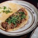 Foto de Taco de Lengua de Res C/Cilantro y Cebolla* (1 pieza) - 237 kcal