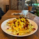 Foto de Papas con cheddar, panceta y verdeo