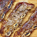 Foto de asado banderita a la parrilla con guarnición a eleción