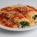 Foto de Canelones rellenos con ricota y verduras con salsa a elección
