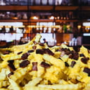 Foto de Papas fritas con cheddar y bacón 