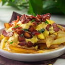 Foto de Papas fritas con cheddar y bacon