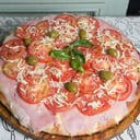 Foto de pizza napolitana con jamon