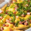 Foto de Papas cheddar ( panceta y verdeo)