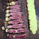 Foto de Chuletón de vaca madurada +45 días de 500gr al josper con puré Robuchon y pimientos de Padrón 