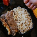 Foto de Bife de costilla con spaghettis con crema