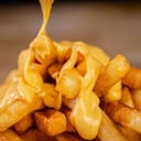 Foto de Papas Bañadas con queso
