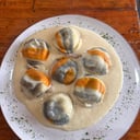 Foto de Sorrentinos de cordero + salsa de queso de cabra con nueces