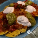 Foto de Nachos con pollo al estilo mexicano, totopos, guacamole, crema agria y pico de gallo