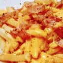 Foto de Papas con salsa cheddar y jamón cocido 