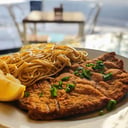 Foto de Milanesa con fideos