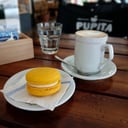 Foto de Café con Leche + Macaron