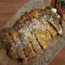 Foto de Cachopo de ternera blanca gallega con jamón duroc, queso de tetilla ahumado y pimientos de piquillo cristalizados