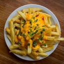 Foto de Papas fritas C / cheddar y verdeo 