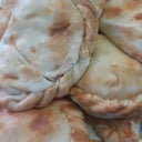 Foto de Empanada de carne cortada a cuchillo