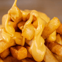 Foto de Papas con salsa cheddar