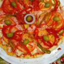 Foto de Muzza con jamón, morron y tomate