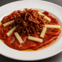 Foto de PIMIENTOS ASADOS CON VIRUTAS DE JAMÓN Y QUESO CURADO