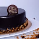 Foto de Torta de Mousse (base de disco de merengue , mousse de chocolate y baño de chocolate semi amargo )