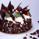 Foto de Torta selva Negra (bizcochuelo de chocolate , chantilly , mermelada de frambuesa y guindas acidas)