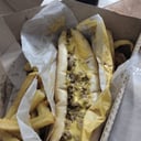 Foto de philli cheesesteak (ojo de bife cortado en tiras, pan baggete, cebolla, morron, mucho queso cheddar liquido)
