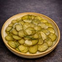 Foto de Pepinillos laminados con aceite de oliva y ajo