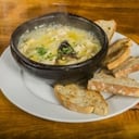 Foto de Pollo y champiñones al pil pil