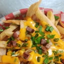 Foto de Papas Fritas con Cheddar y Bacon