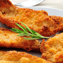 Foto de Filet de merluza rebozado con guarnición a elección