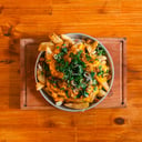 Foto de Papas con cheddar, bacon y verdeo