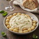 Foto de Ñoquis tradicional con salsa blanca