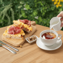 Foto de Combo 3: Café con leche / Té con leche + Tostada integral con huevo y jamón