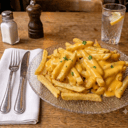 Foto de Papas fritas con cheddar y verdeo (para compartir)