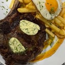 Foto de Ojo de bife c/ guarnición a elección.